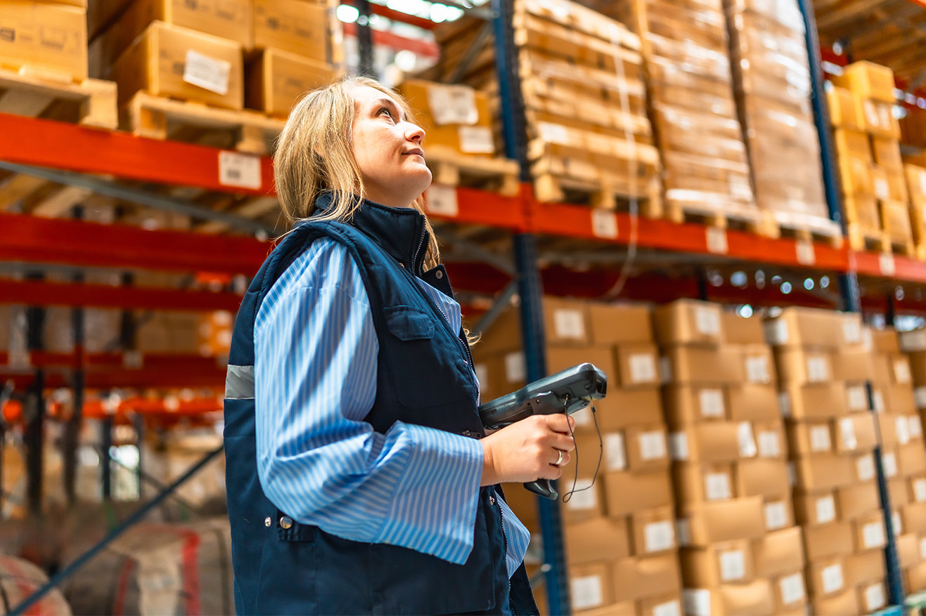 Store Employee Monitoring Inventory Stock with a Scanner