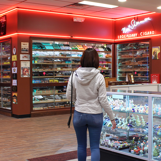 woman shopping inside a premium cigar retail store
